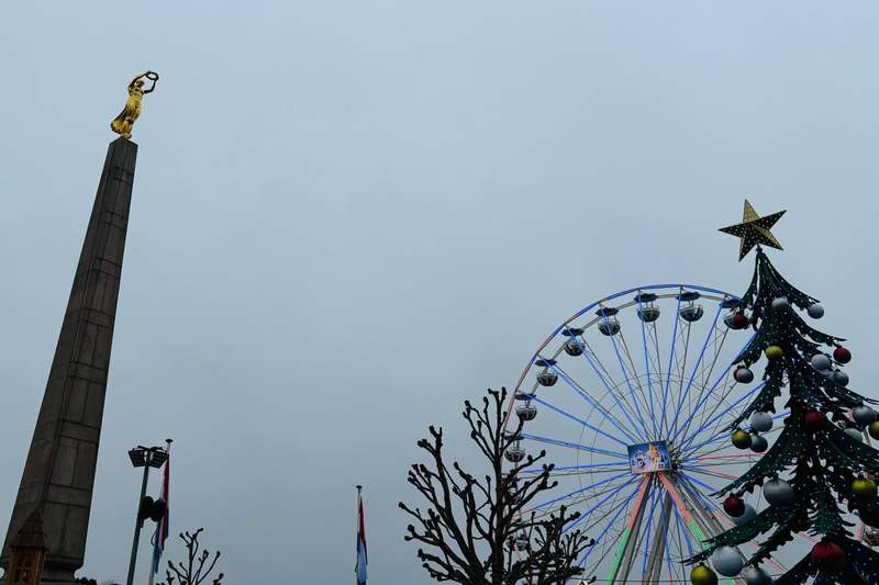 The Gëlle Fra monument with the Christmas big wheel turning behind it.